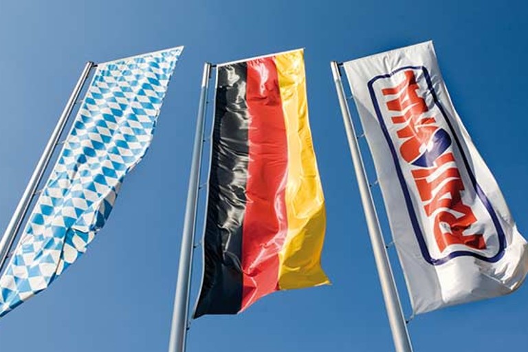 Flags of Bavaria, Germany, and Rational waving in the wind.