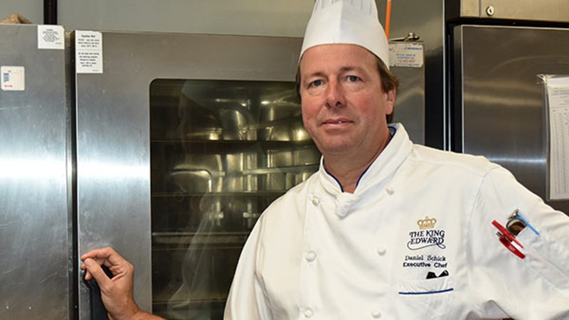 Chef Daniel Becke, Executive Chef at Omni King Edward Hotel, standing by a Rational oven.