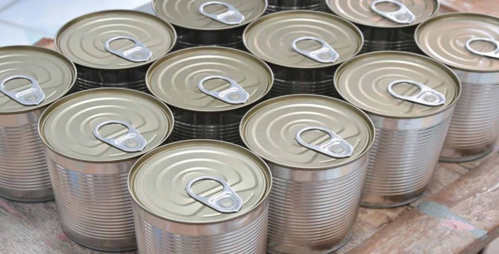 An overhead photo of a pallet of tin cans