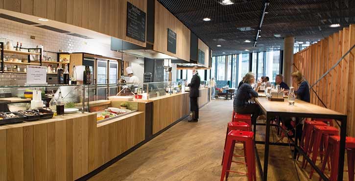 an open-kitchen restaurant with customers enjoying a meal