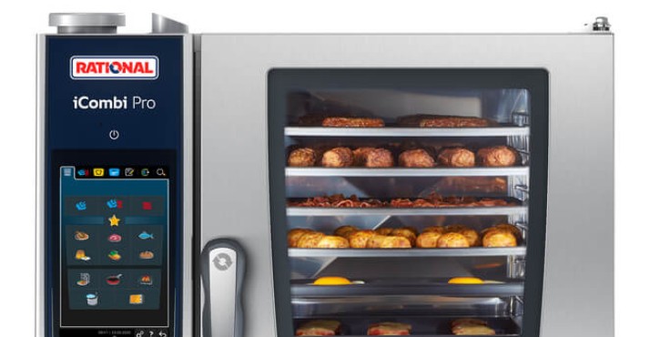An iCombi Pro XS with a mixed load, breakfast items cooking on different shelves, such as sausages, hash browns, bacon and tomatoes.
