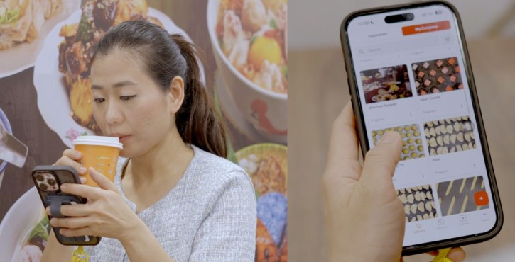 Woman using the ConnectedCooking app on a smartphone while drinking coffee.