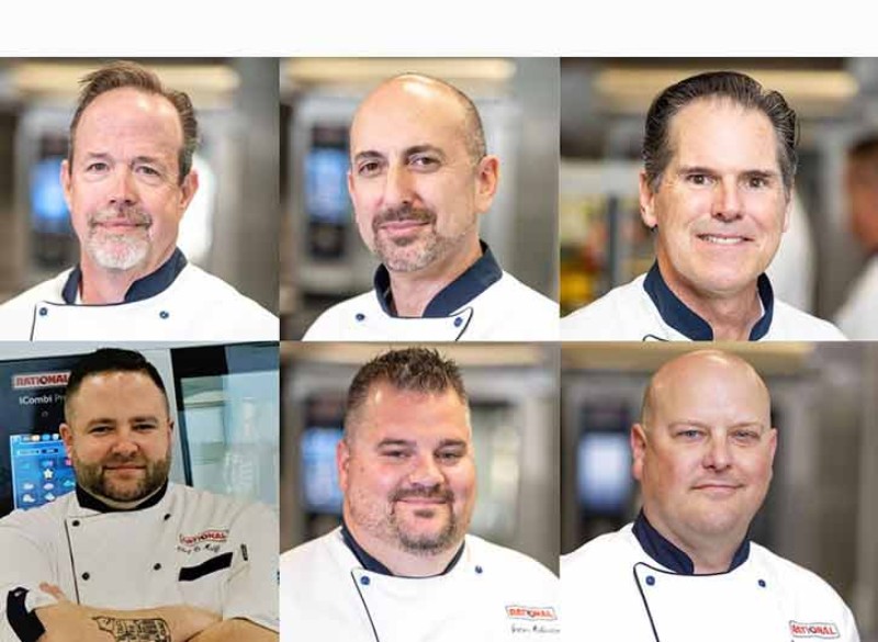 Six professional chefs in two rows of three, each wearing chef's whites and posing in a kitchen setting. The chefs are presenting a friendly demeanor with some of them slightly smiling.