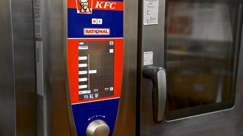 RATIONAL SelfCookingCenter control panel with KFC branding in commercial kitchen.