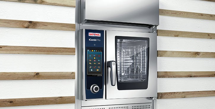 A modern Rational iCombi Pro oven, showcasing its sleek design and touch control panel against a wooden backdrop.