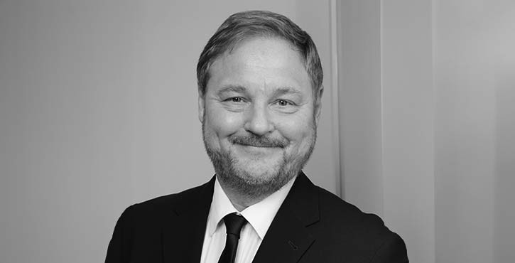 Portrait of Michael Butler, smiling warmly.