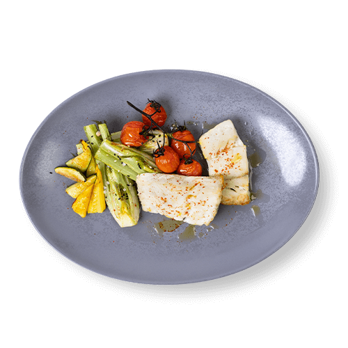 Plate of grilled fish fillets served with roasted vegetables and cherry tomatoes.