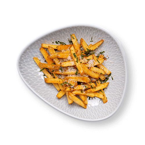 A close-up of a plate of golden French fries garnished with herbs, served in a unique, decorative dish.