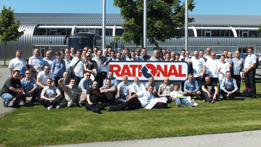 Group of RATIONAL employees gather in front of the RATIONAL plant.