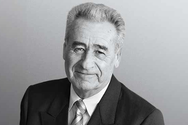 Siegfried Meister, founder of RATIONAL, in a classic black-and-white portrait.