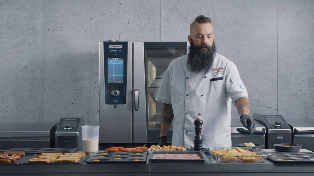 Chef preparing food in front of RATIONAL iCombi Pro combi oven.
