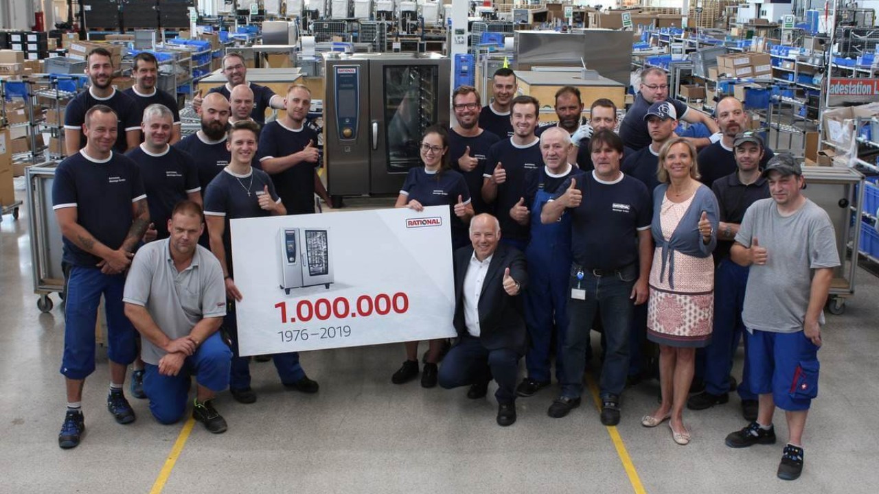 Group photo celebrating the production of the 1,000,000th Rational combi-steamer, featuring employees and representatives.