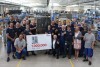 Group photo celebrating the production of the 1,000,000th Rational combi-steamer, featuring employees and representatives.