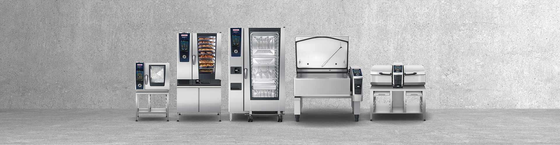 A lineup of RATIONAL kitchen appliances, including ovens and cooking equipment, against a concrete background.