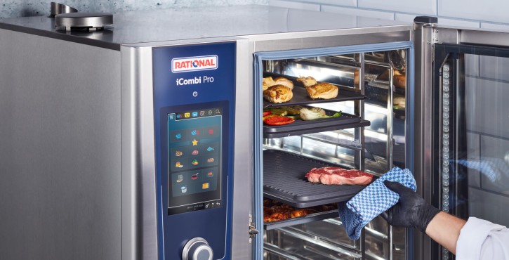 A close-up of the Rational iCombi Pro display showing the cleaning phase with a timer indicating 12:45 minutes remaining and a warning not to open the door.