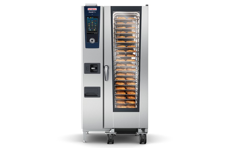 A Rational iCombi Pro oven displaying multiple trays of cooking food through its glass door.