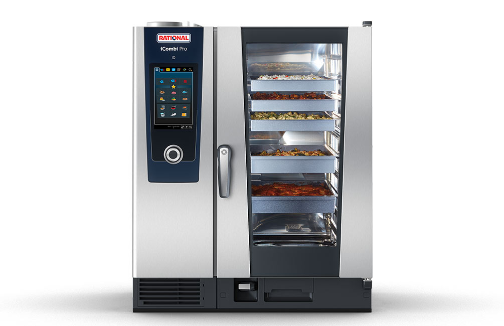 Front view of a Rational iCombi Pro oven with various trays of food visible inside.