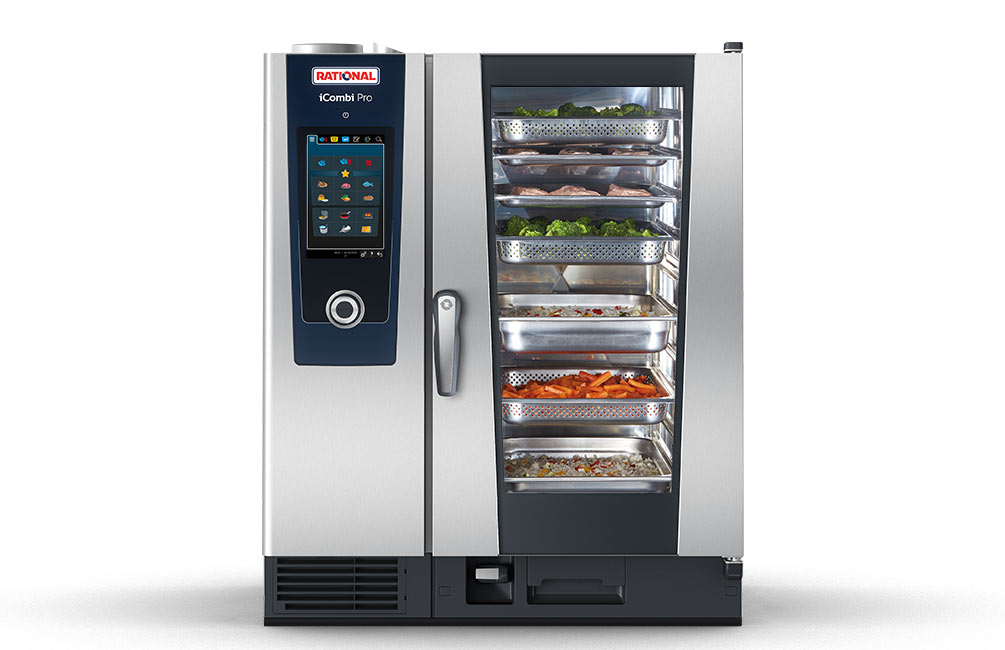 A Rational iCombi Pro oven with various food items displayed in trays, including vegetables and meat, shown from the front.
