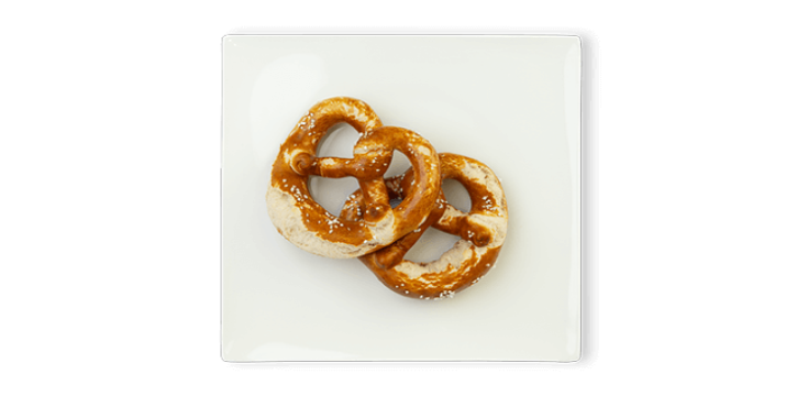Two salted pretzels on a white square plate.