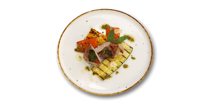Gourmet plate with grilled zucchini, roasted peppers, and sliced meat, topped with herbs.
