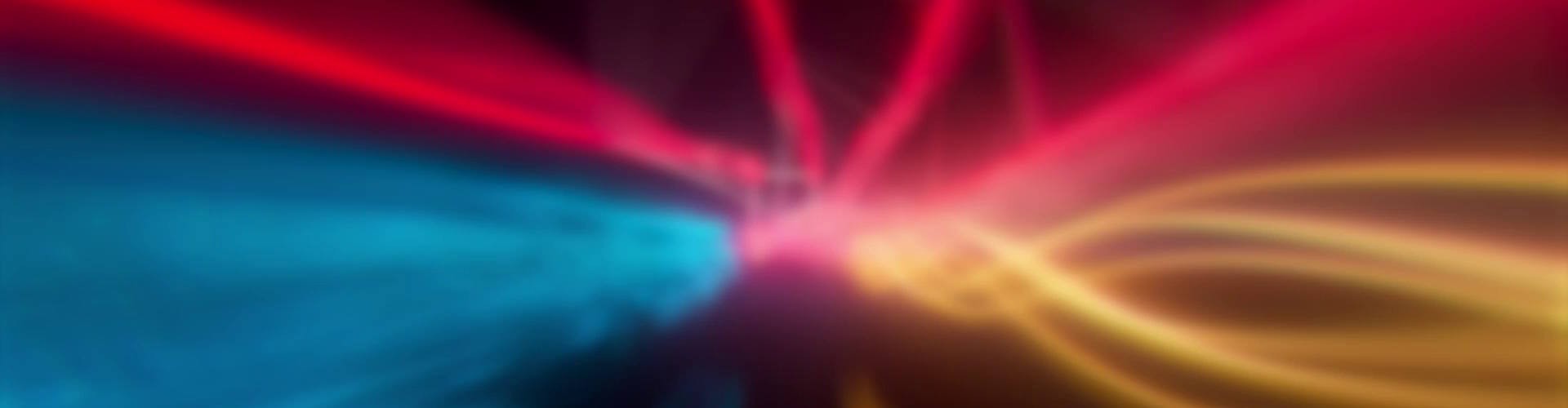 Abstract energy flow with blue, red, and yellow light trails converging towards the center.