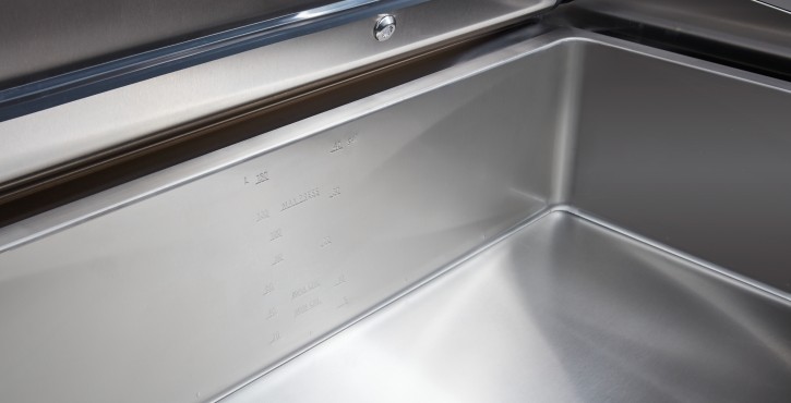A close-up view of the interior of a Rational iVario Pro cooking appliance, showing the stainless steel surface and measurement markings.