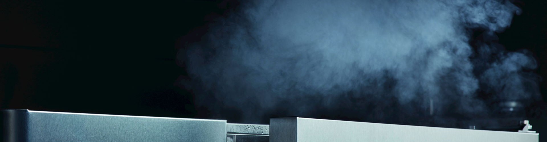 A Rational SelfCookingCenter emitting steam from an open door, highlighting its cooking capabilities.