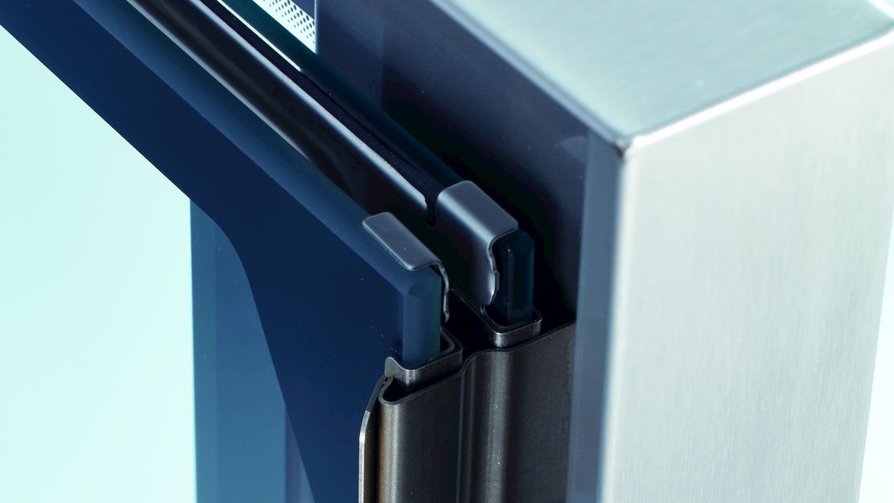 Close-up of RATIONAL iCombi Pro combi oven door hinge and sealing system.