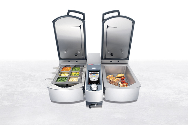 RATIONAL iVario Pro 2-S – a modern, multifunctional cooking system with two pans, shown on a mobile stand with integrated storage compartments.